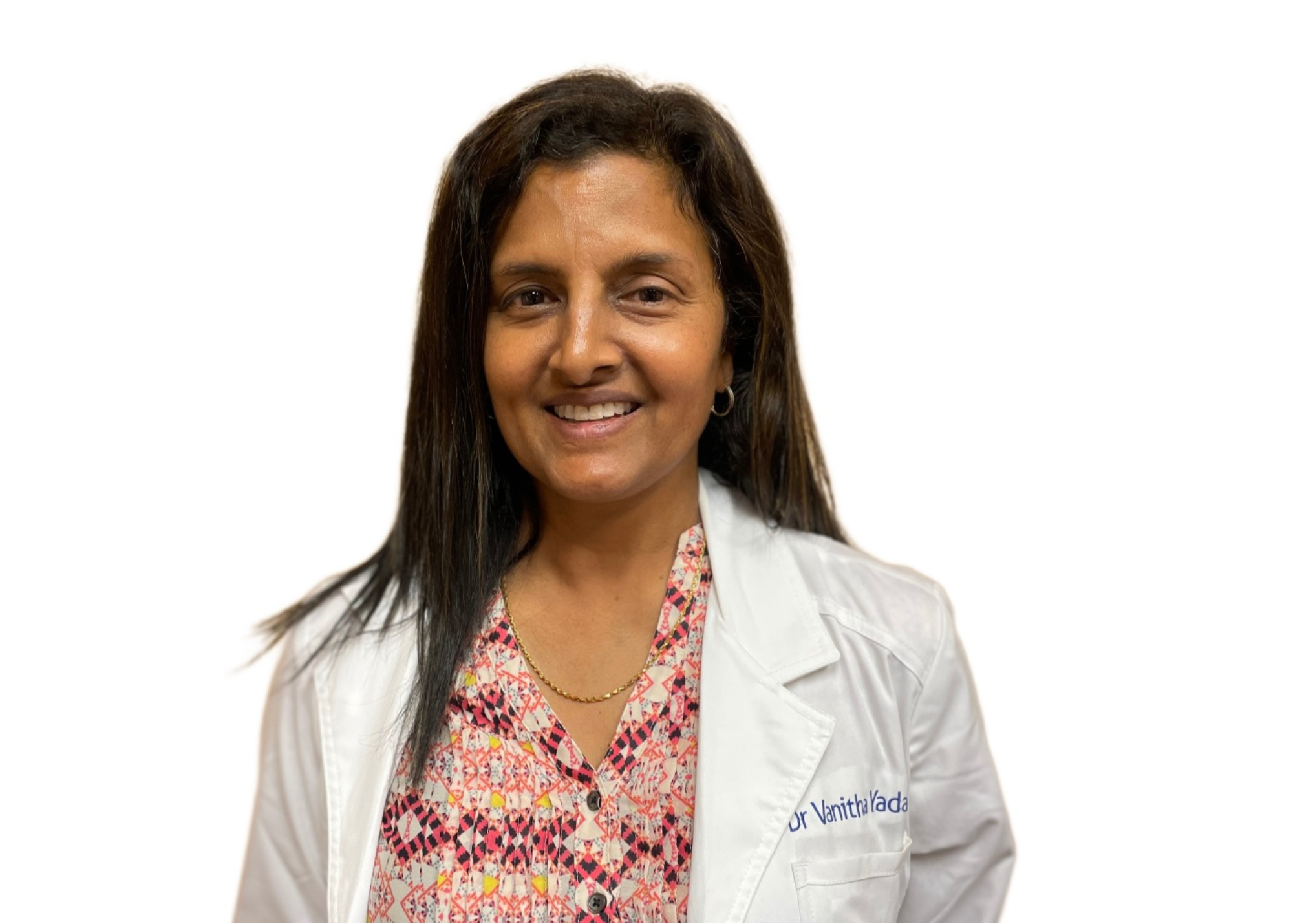 Dr. Vanitha Yadalla, portrayed in a professional white coat, smiles confidently, conveying expertise and approachability.