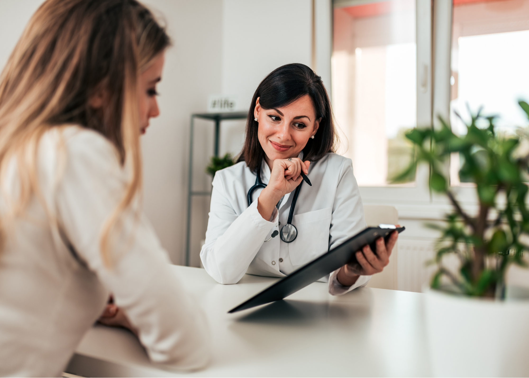 A compassionate doctor in a clinic, holding a clipboard and attentively listening to a patient, creating an atmosphere of trust and personalized care.